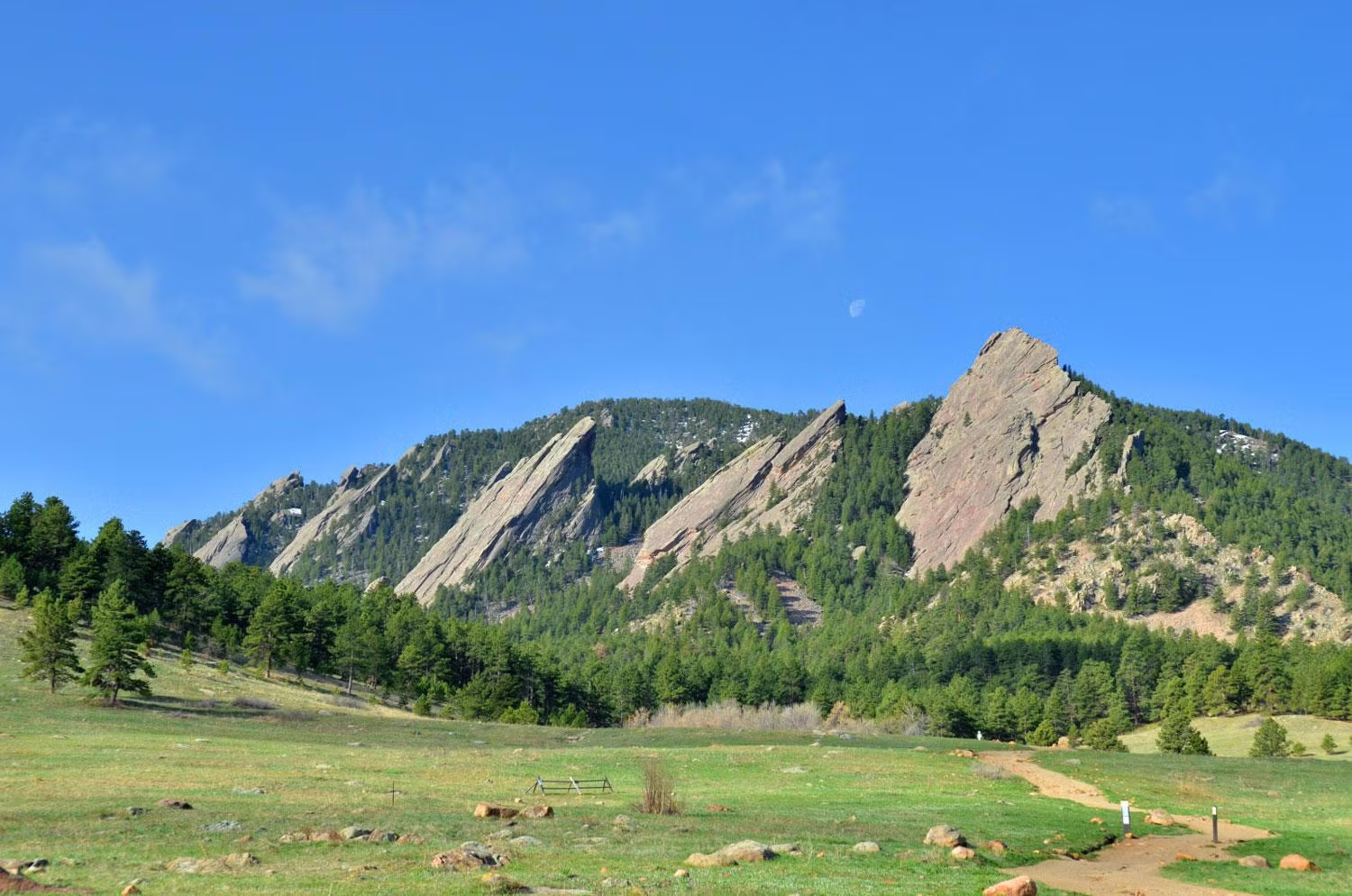 Flatirons mountain backdrop in Boulder, Colorado near Chautauqua Park, a scenic landmark surrounding Boulder homes and real estate.