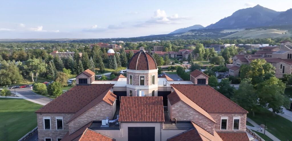 University of Colorado Boulder campus with Flatirons mountain backdrop, highlighting Boulder, Colorado lifestyle and real estate.