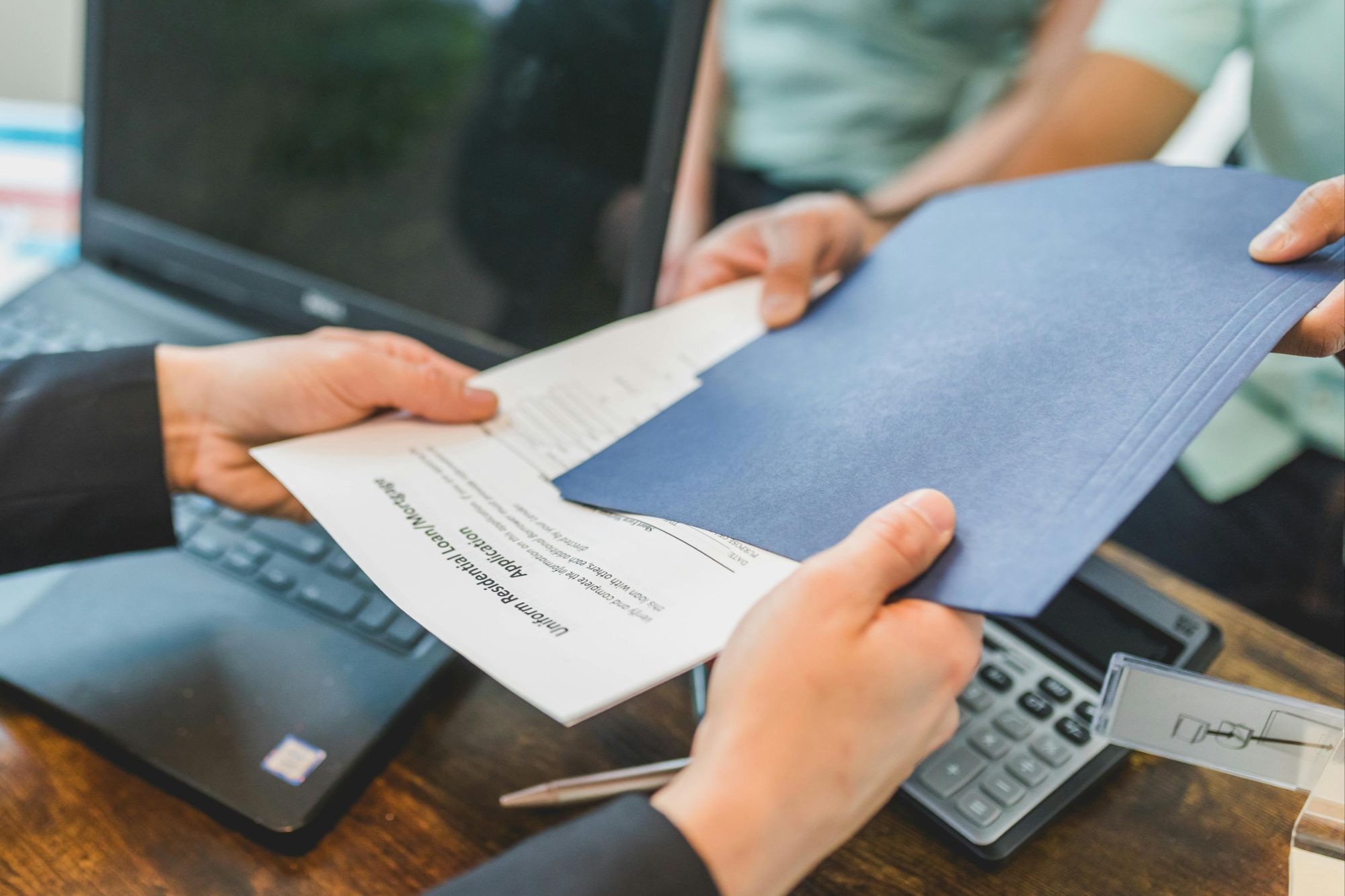 Calculator and estate documents showing probate real estate costs in Boulder, Colorado.