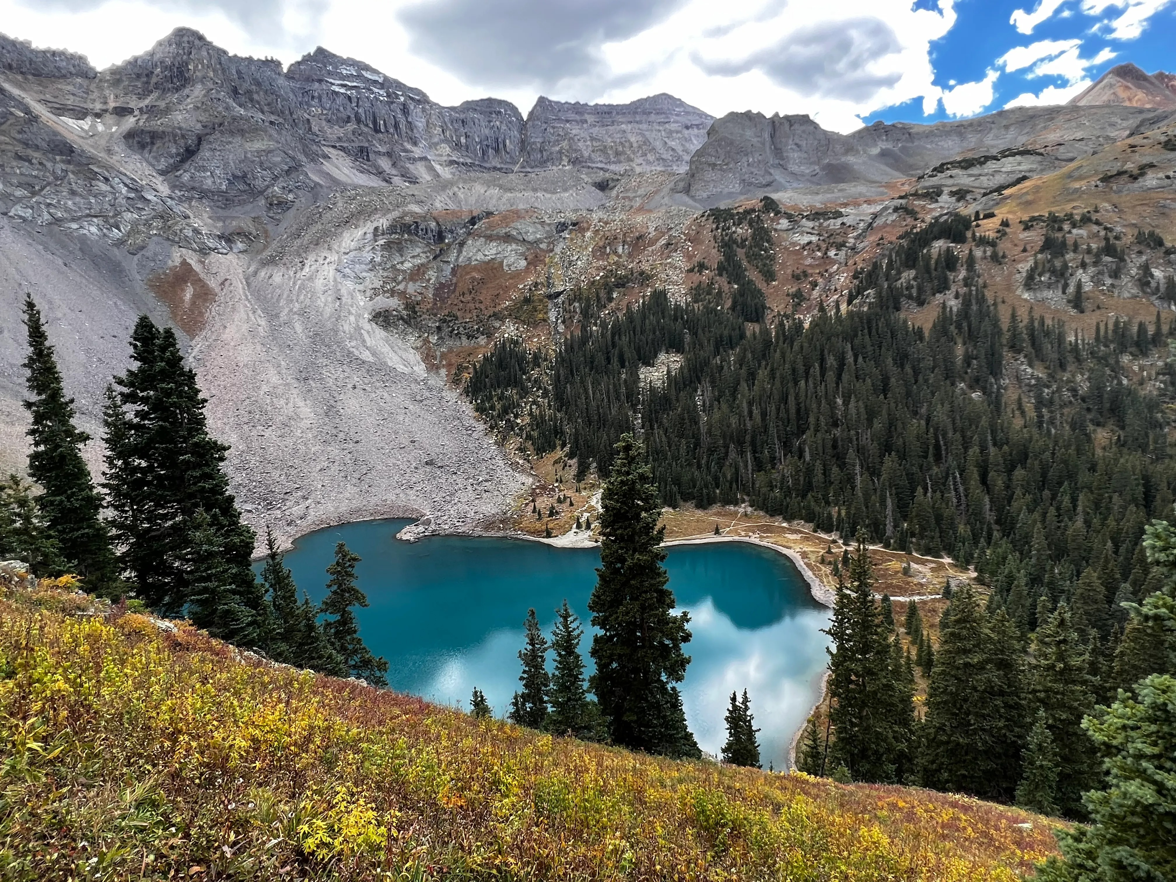Crater Lake trail at Maroon Bells with dramatic mountain scenery on a long day trip from Boulder.
