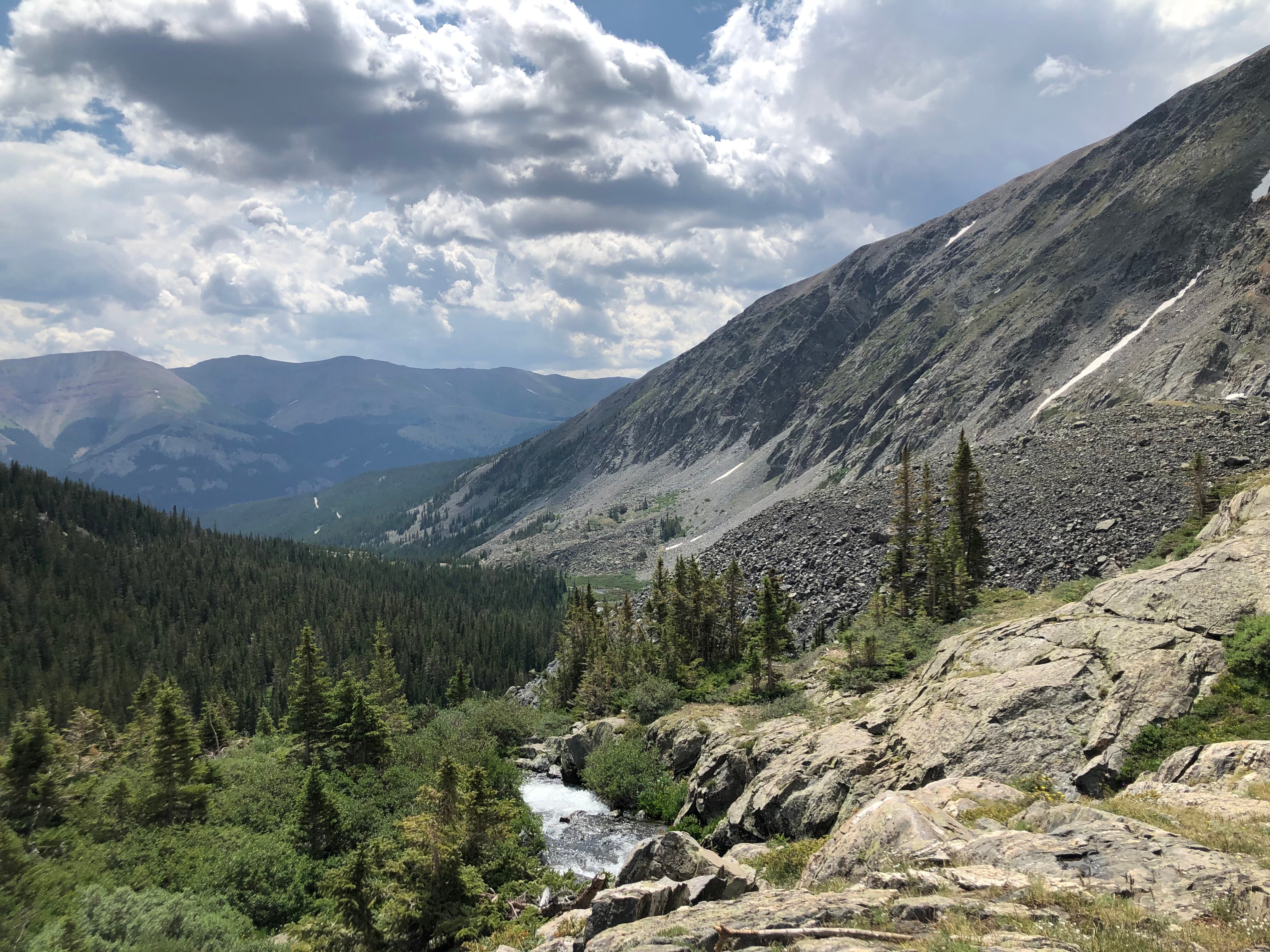 McCullough Gulch trail near Breckenridge with waterfalls, alpine meadows, and mountain views from a Boulder day trip.