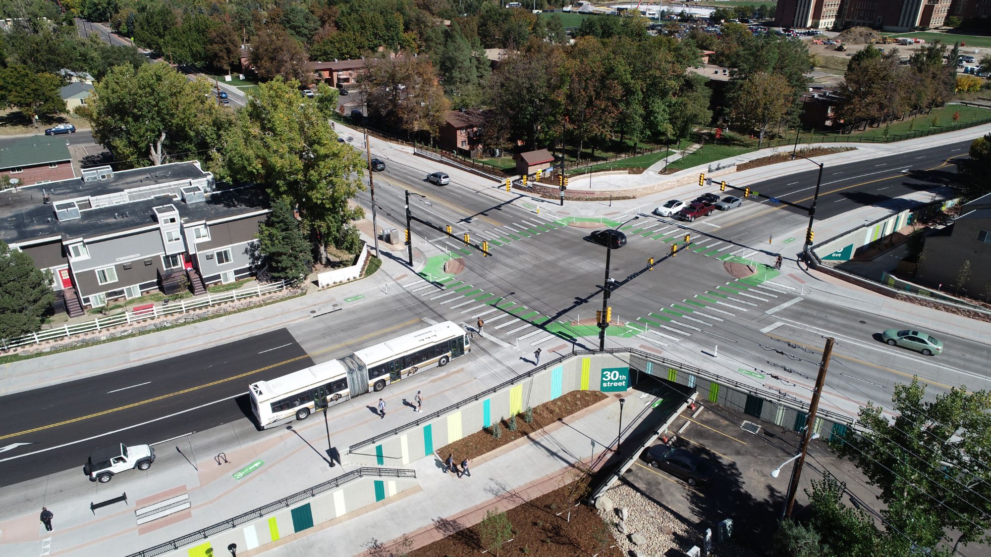 Boulder Junction transit hub on 30th Street with mixed-use residential buildings and bike lanes in Boulder, Colorado