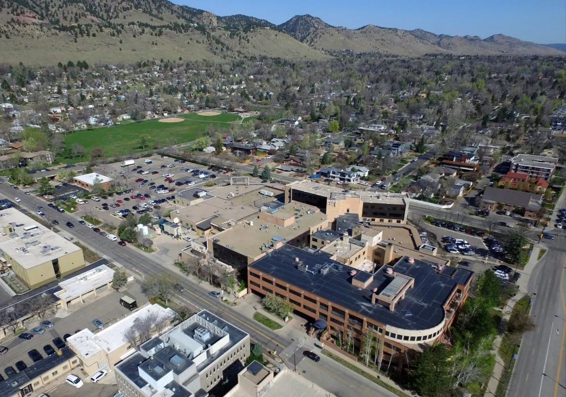 Former Boulder Community Health hospital site at Alpine and Balsam in North Boulder, Colorado during redevelopment with Broadway in the background