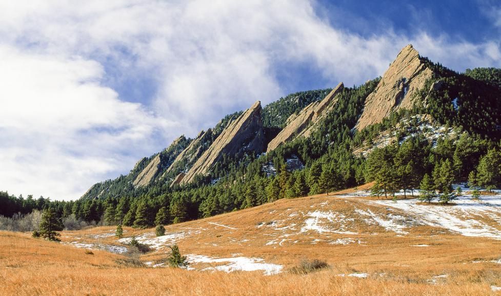 Boulder Colorado protected open space and green belt with the Flatirons rock formations in the background showing the city's land conservation boundaries