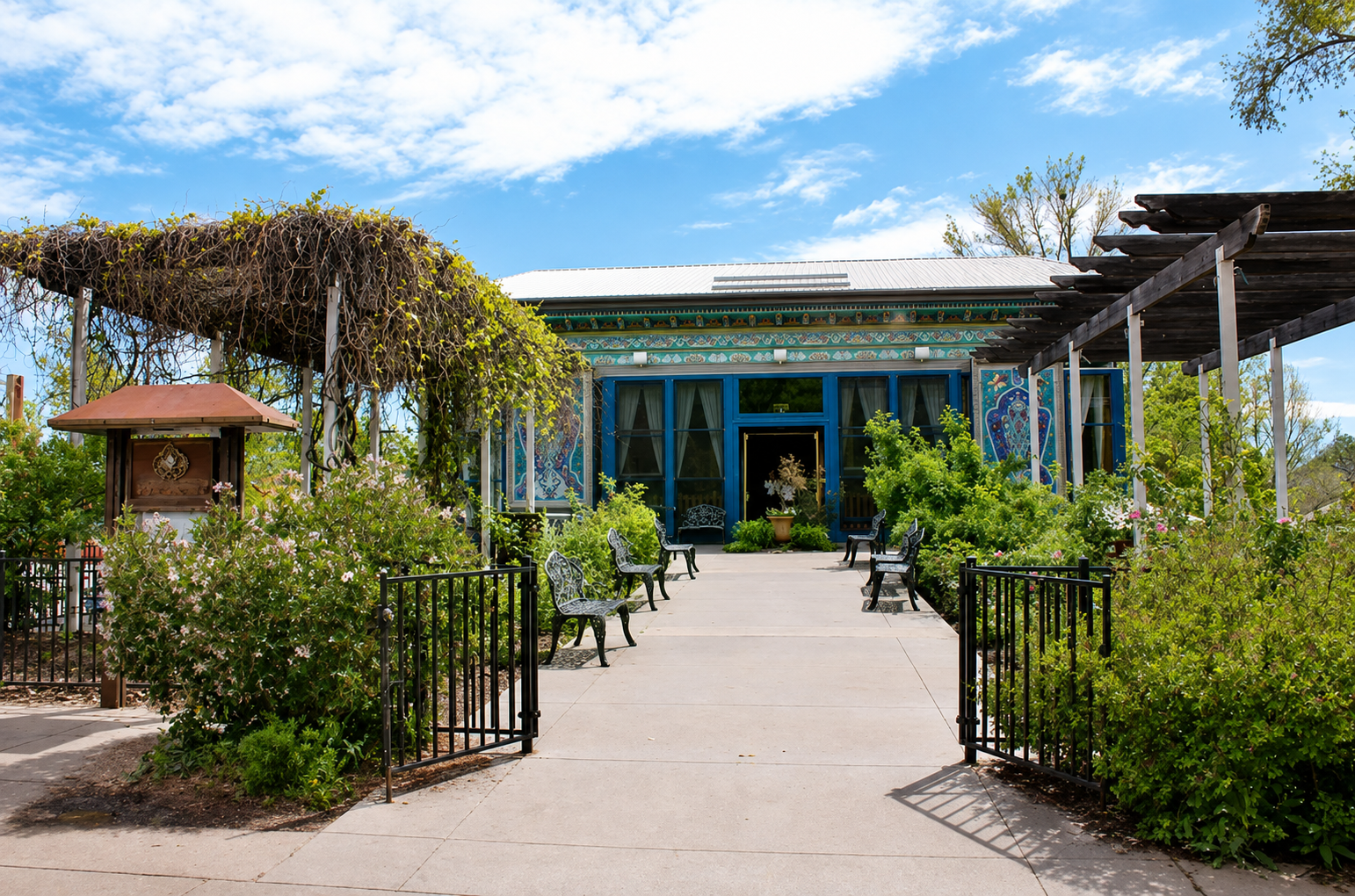 Outdoor tables beside gardens and historic architecture in Boulder, Colorado