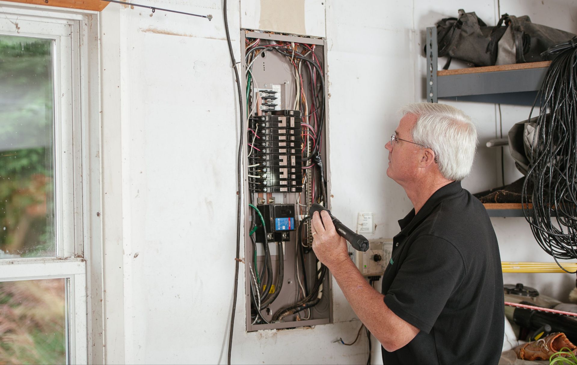  Licensed electrician evaluating an older electrical system in a Boulder home.