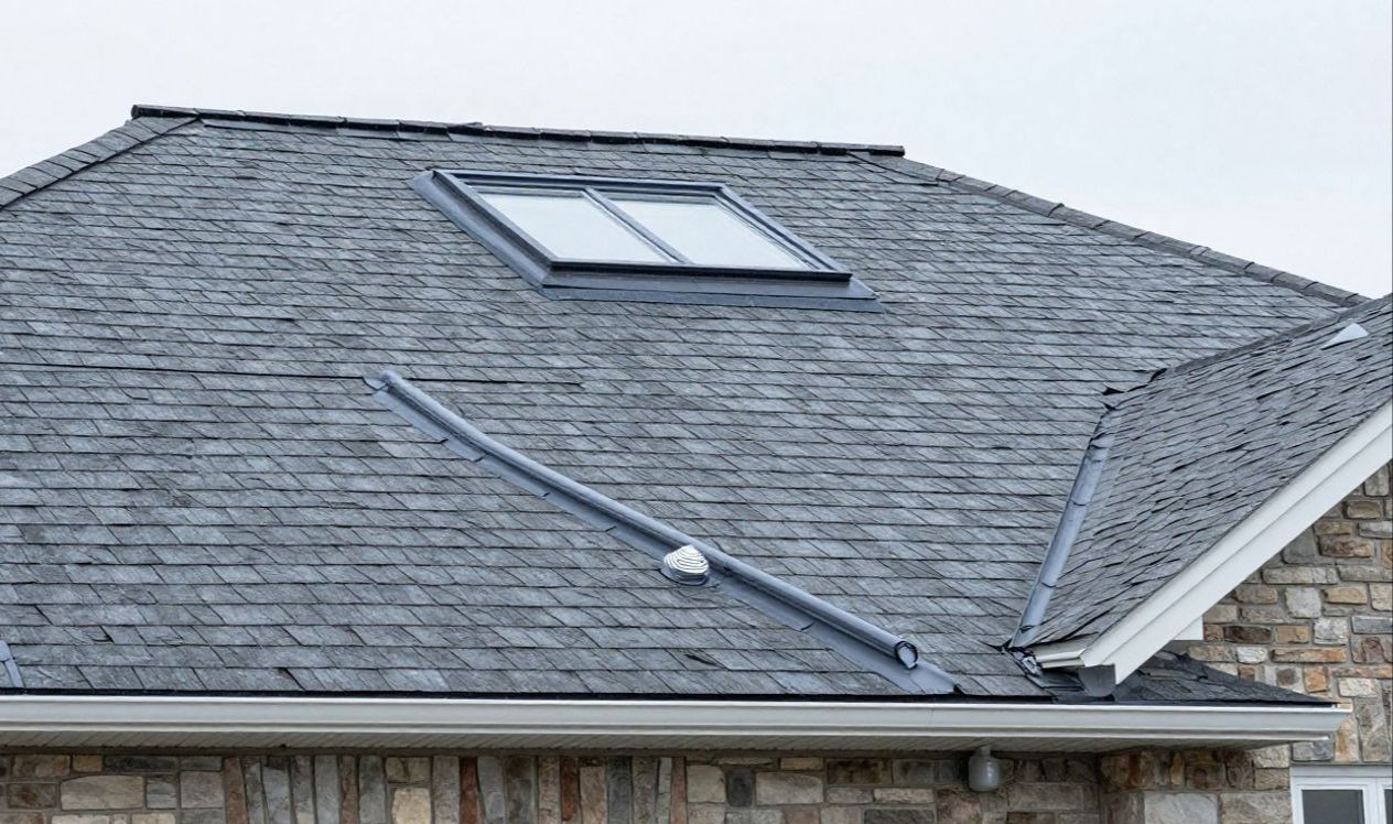 Roof flashing, shingles, and vent penetration being inspected on a Boulder home.