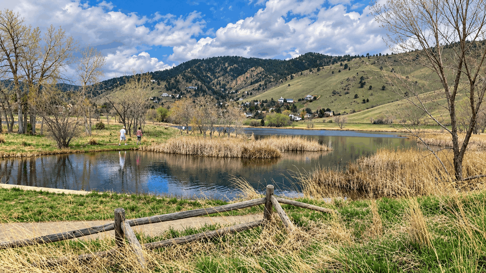 Wide walking trail beside Wonderland Lake with Boulder foothills in the background