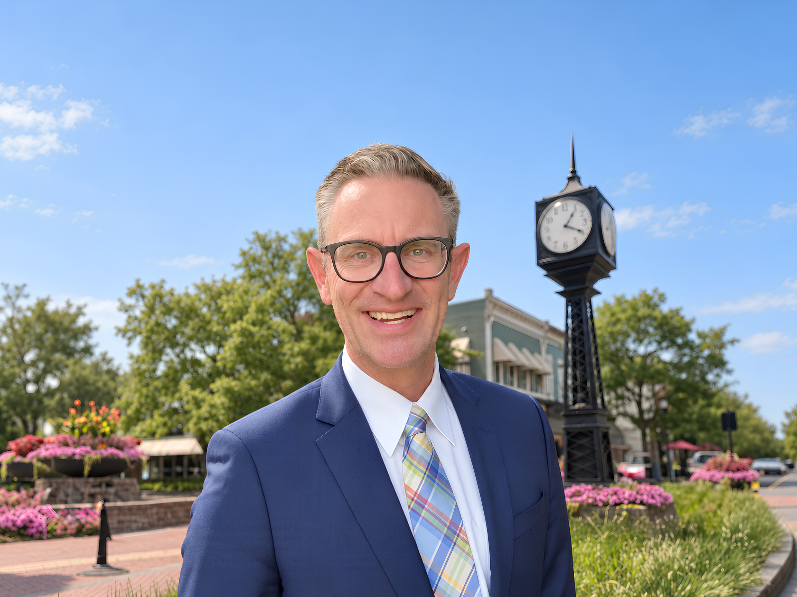 Jeff Duneske, Associate Broker with Keller Williams Advantage, beside the clock in downtown Northville, Michigan.