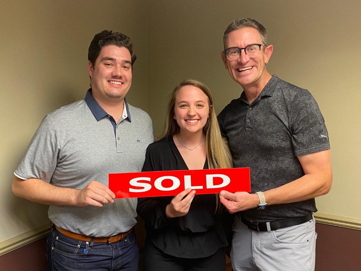 Jeff Duneske celebrating a home closing with Joe & Madison in Livonia, Michigan