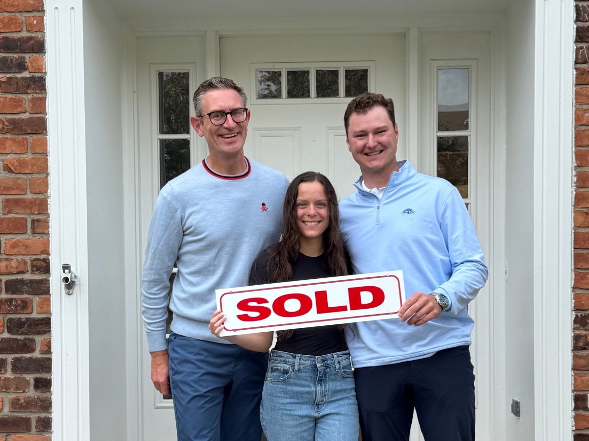 Jeff Duneske celebrating a home closing with Matt & Gabby in Plymouth, Michigan