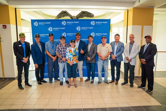 North Port city officials and Detwiler's Farm Market representatives posing together at City Hall for the announcement