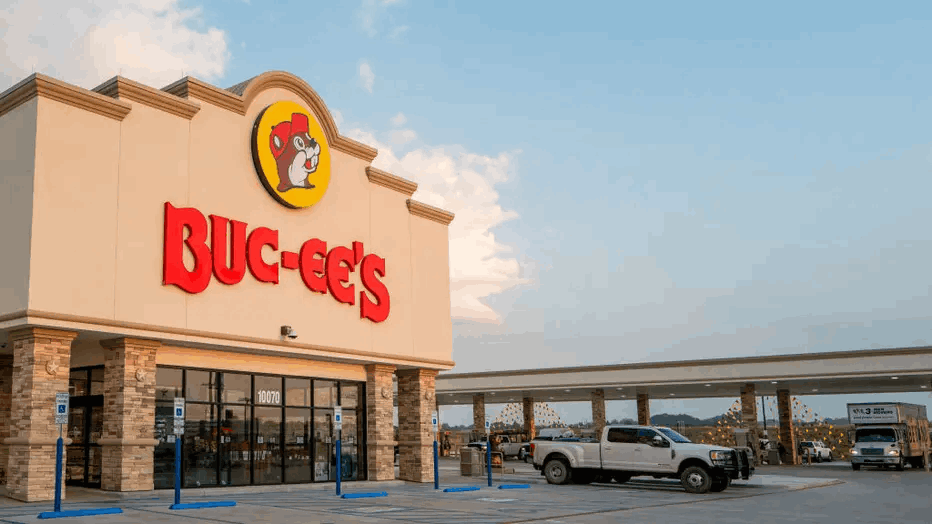 Existing Buc-ee's travel center storefront with fuel canopy and parking lot, shown for context