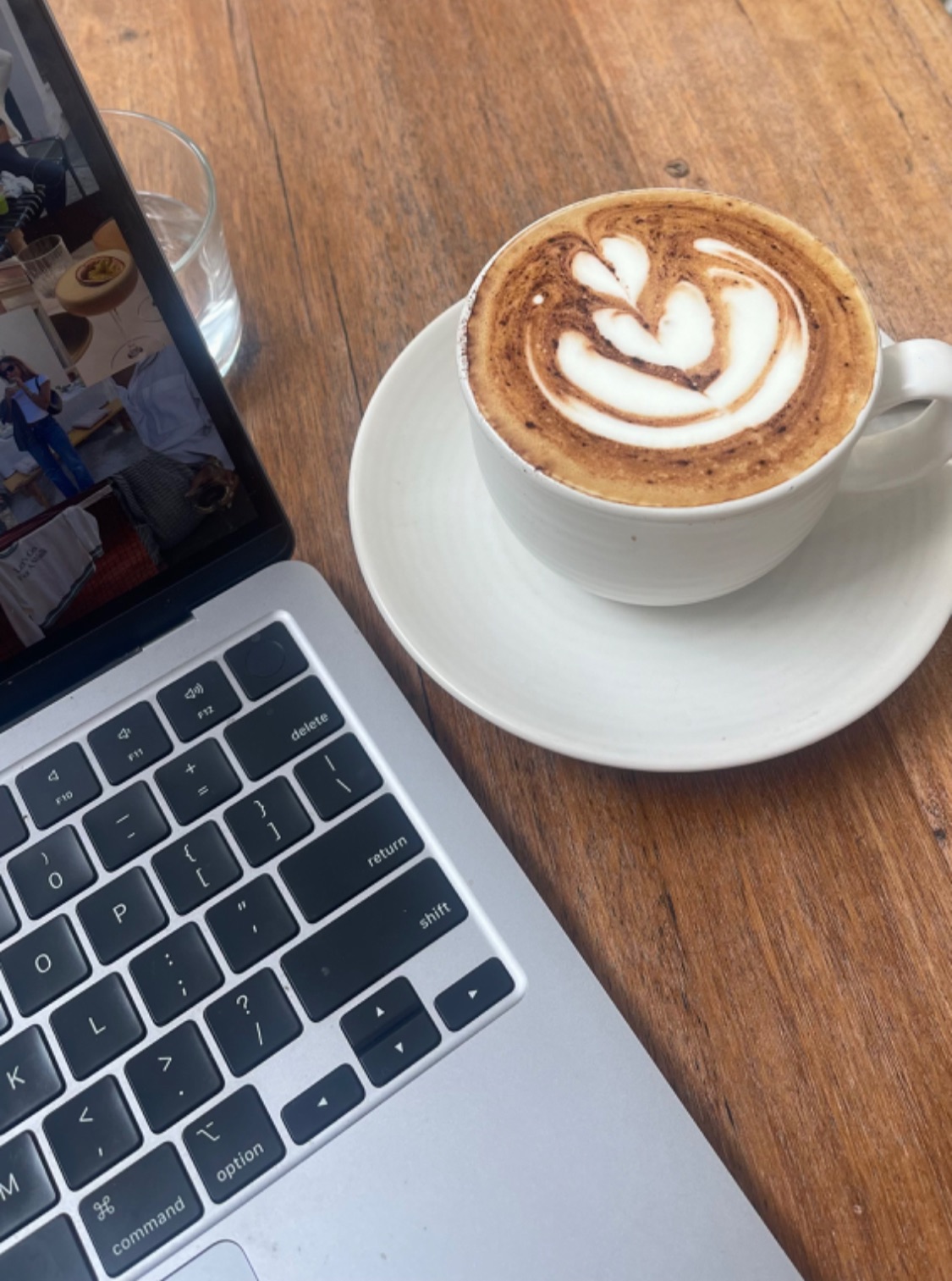 Remote worker using a laptop in a Mesa Arizona coffee shop with natural light. 