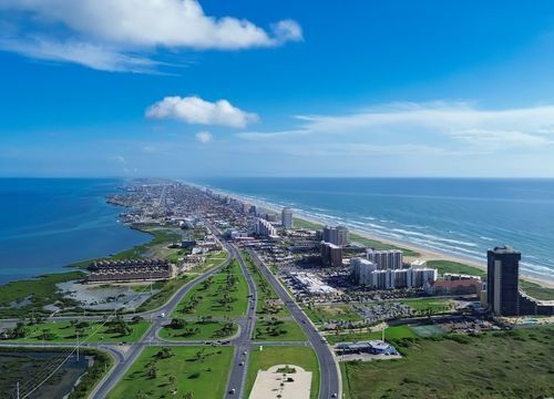 imgi_7_Downtown-South-Padre-Island-along-Padre-Boulevard-State-Park-Road-100-from-Isla-Blanca-Beach-high-rise-condos-beach-front-hotels-white-sandy-beaches-turq