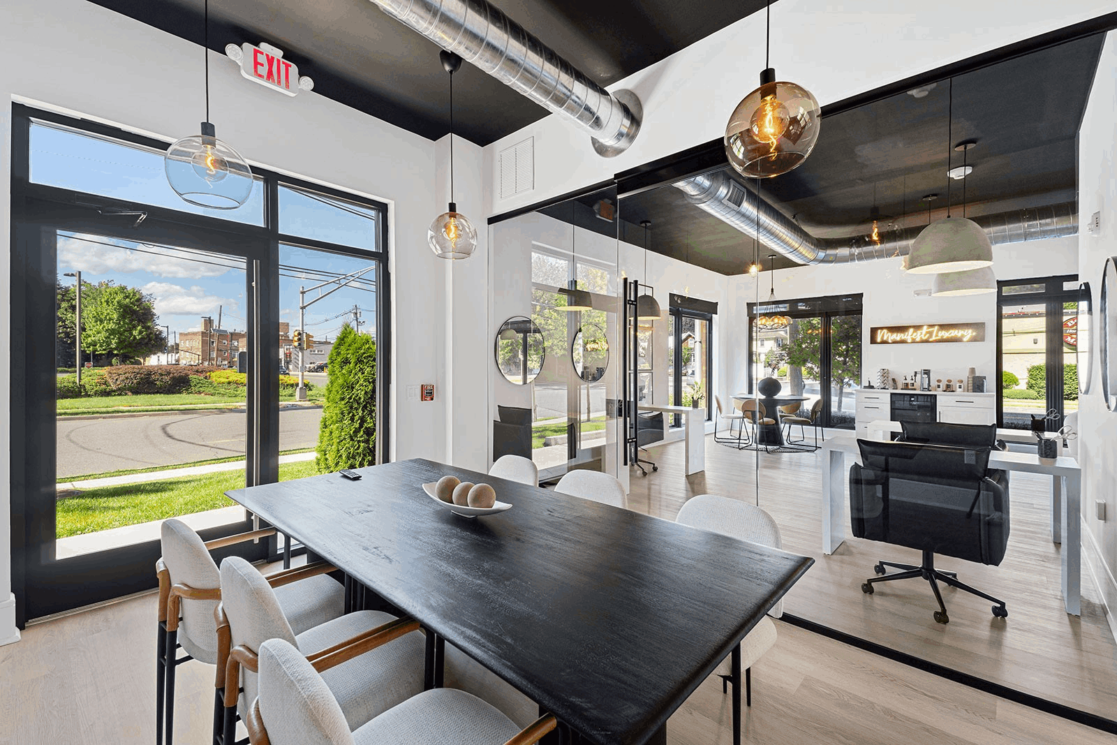 Modern office interior with table and chairs, large windows and plants, landscape aspect ratio 720:420