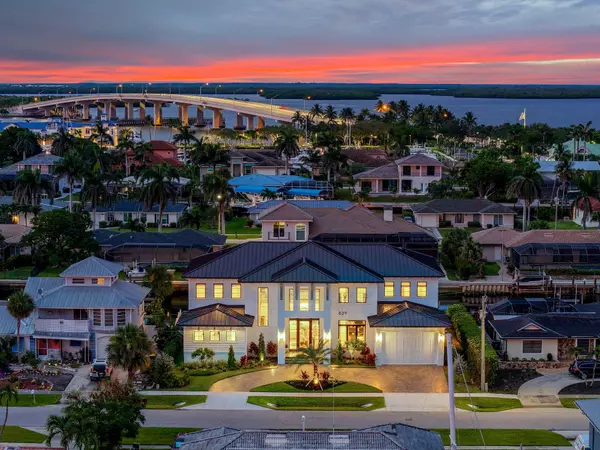 Luxury waterfront estate on Marco Island with direct Gulf access and views of the SS Jolley Bridge at sunset
