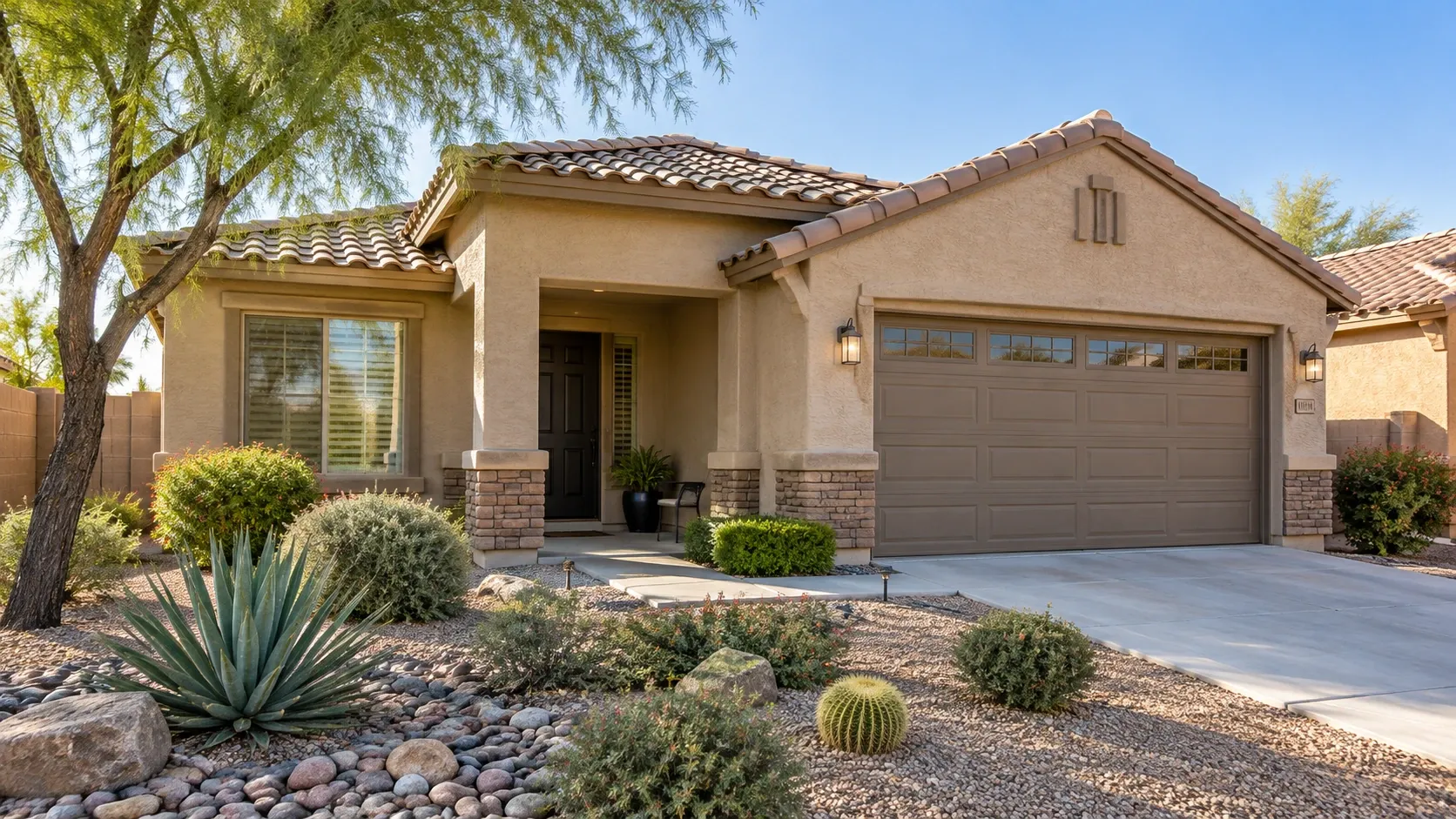 Single-story Arizona home with a tidy entrance and desert landscaping.