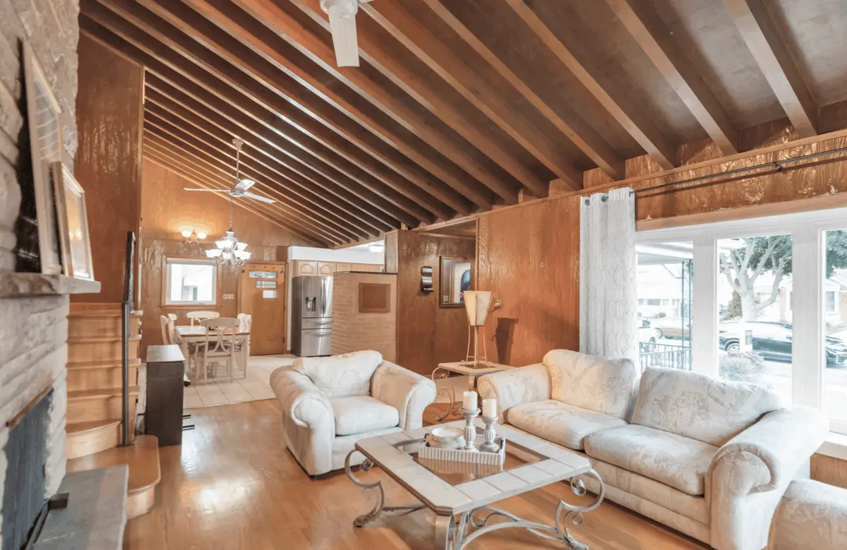 Gorgeous interior living room space with vaulted ceilings and exposed wooden beams