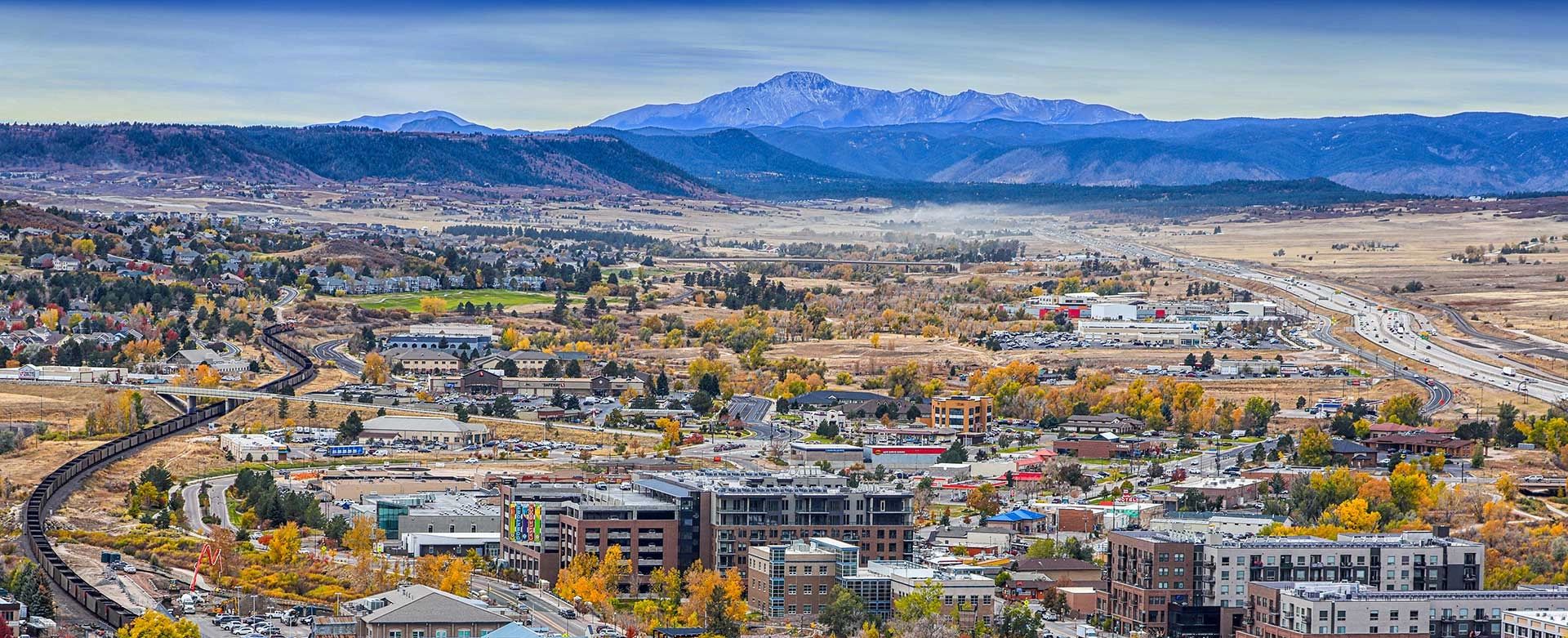 Aerial view of Castle Rock Colorado with I-25 and Pikes Peak