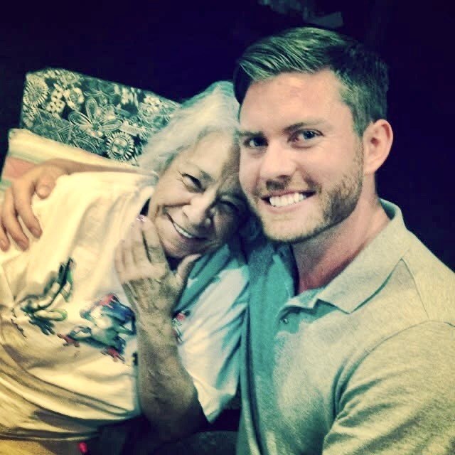 Nate Smith smiling with his grandmother, indoors