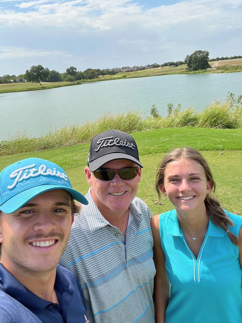 Andrew with his kids on the golf course