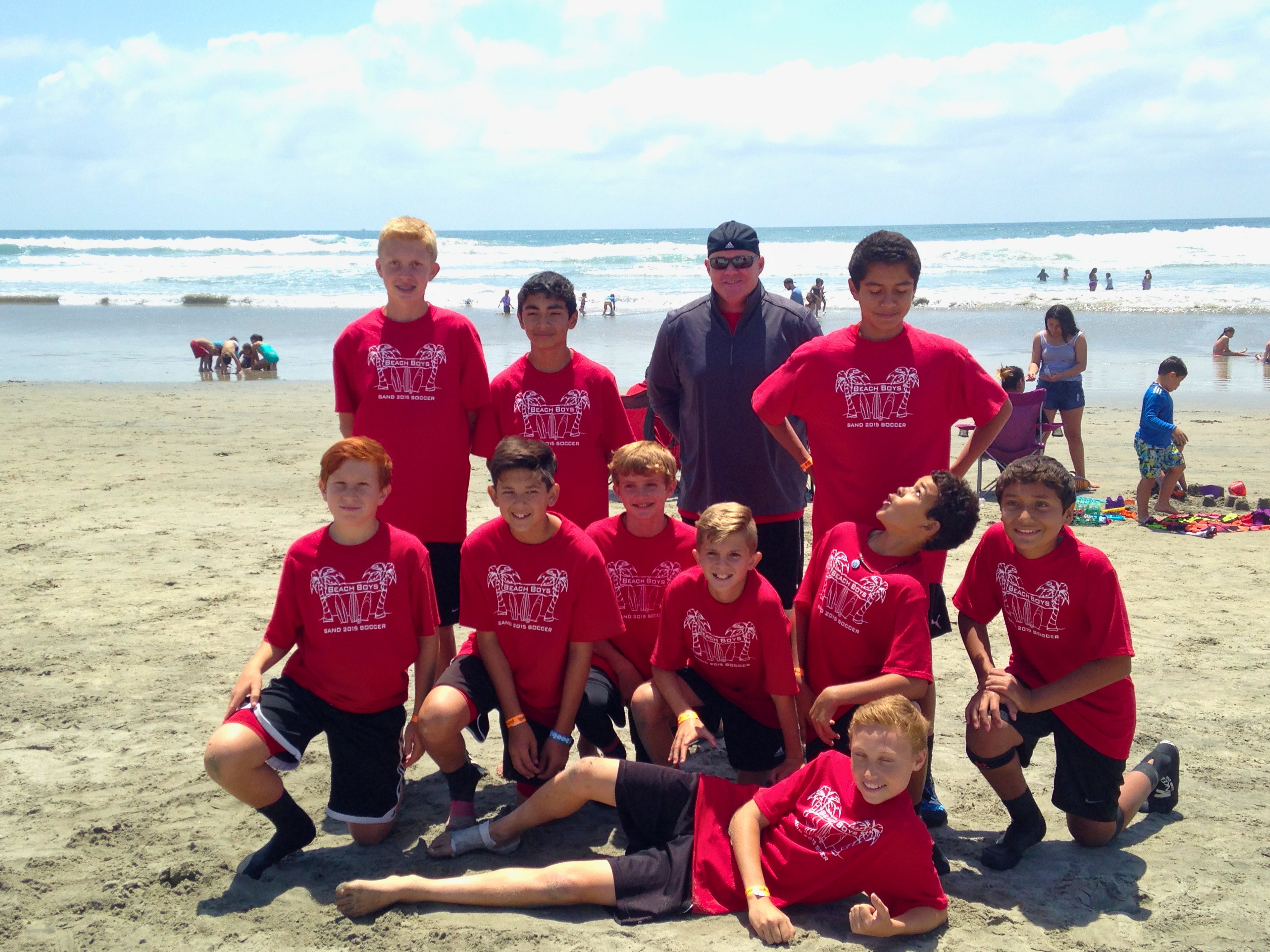 Andrew with the beach soccer team he coached
