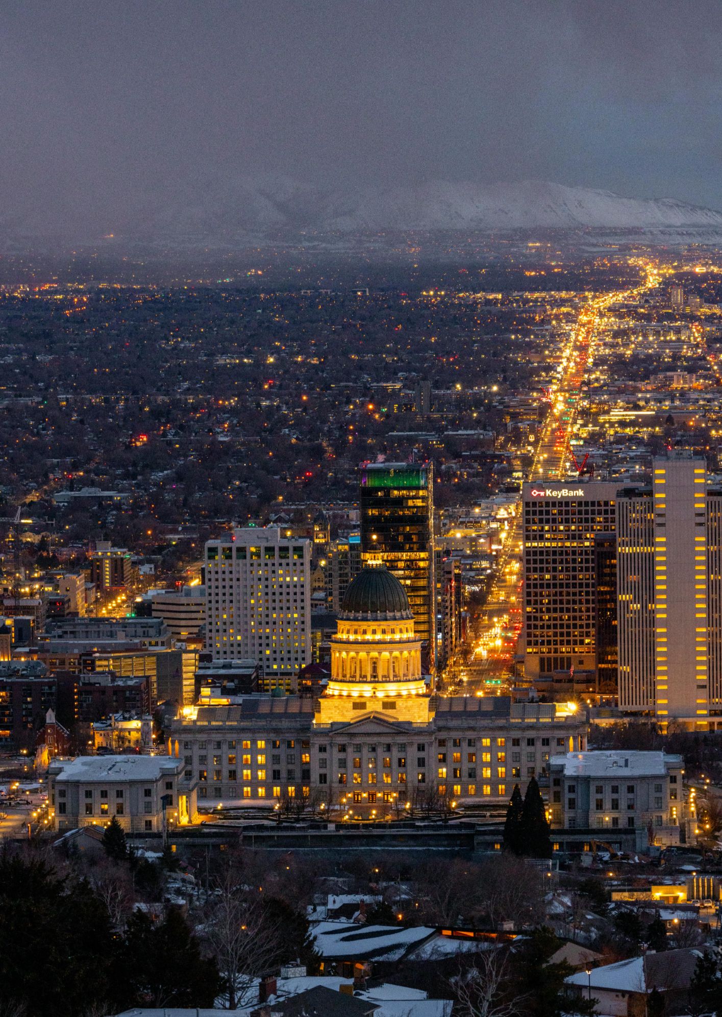 Nighttime view of the Utah State Capitol building and Salt Lake City skyline - 2026 Relocation Guide.