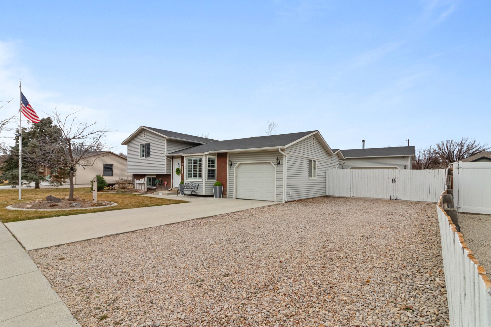 Front exterior of 12468 S 1510 W in Riverton, Utah - a 4-bedroom home featuring a massive detached workshop and RV parking.