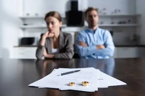 Stock-Couple-Sitting-At-The-Table-With-Divorce-Documents-AdobeStock_293647295-copy