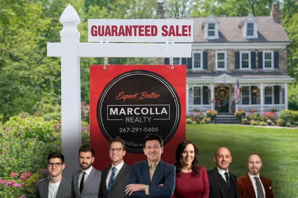 Marcolla Realty guaranteed sale sign with the team