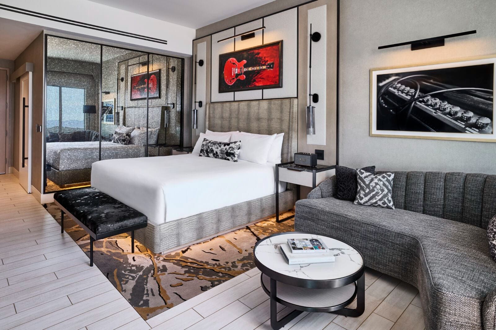 Interior of a luxury suite at VAI Resort in Glendale, Arizona, featuring modern design elements, music-themed artwork, upscale furnishings, and a spacious layout—part of the highly anticipated resort opening later this year.