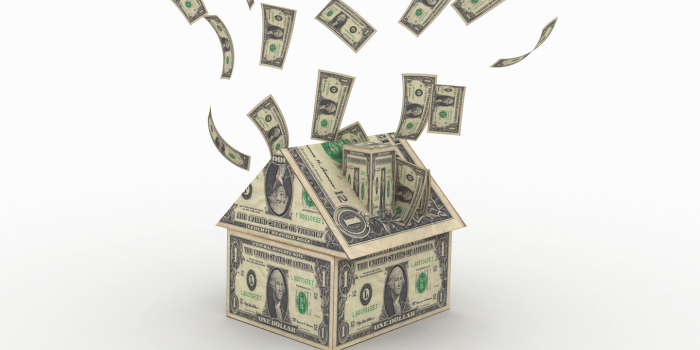 Cash flowing out of a house made of dollar bills, representing the 'live in one, rent the rest' real estate strategy to offset your mortgage and generate passive income
