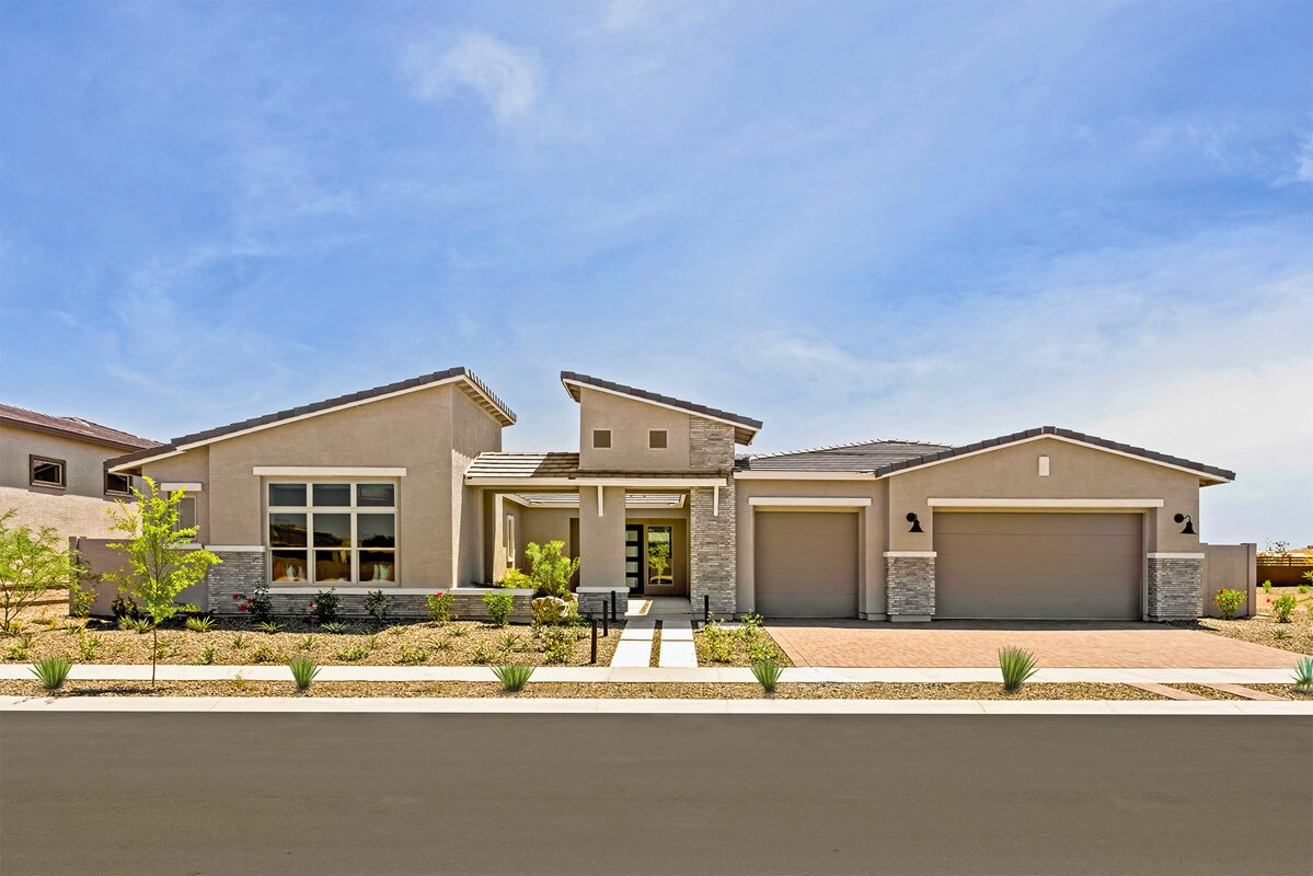 Modern new construction home in Arizona with desert landscaping and three-car garage, representing 2025 builder incentives, quick move-in opportunities, and design quality