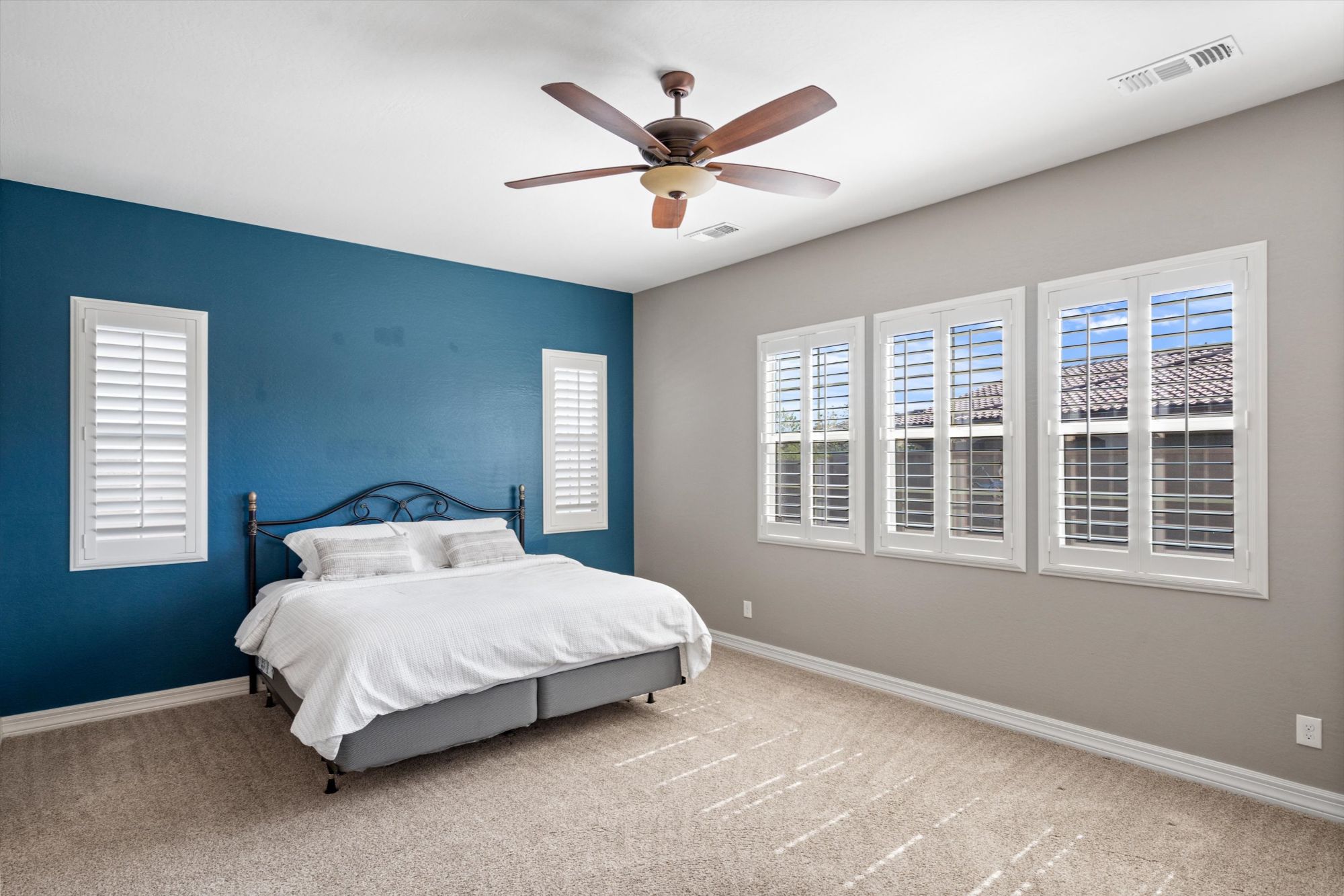 Primary suite of a single-level 55+ home in Buckeye