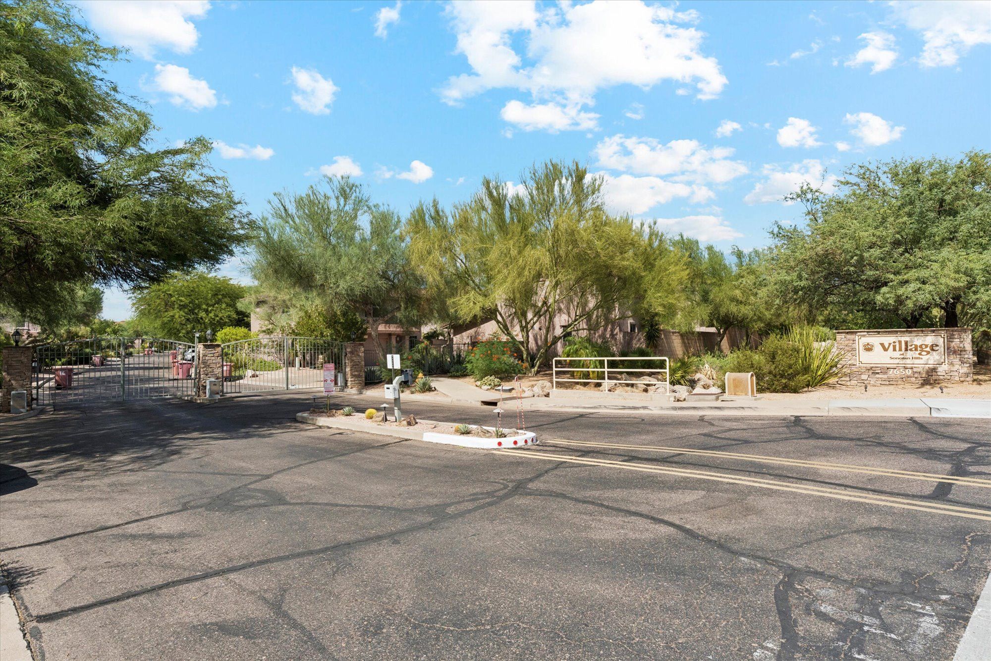 Gated entrance to Village at Scottsdale Hills community in North Scottsdale featuring desert landscaping, controlled access, and private residential neighborhood near Scottsdale amenities