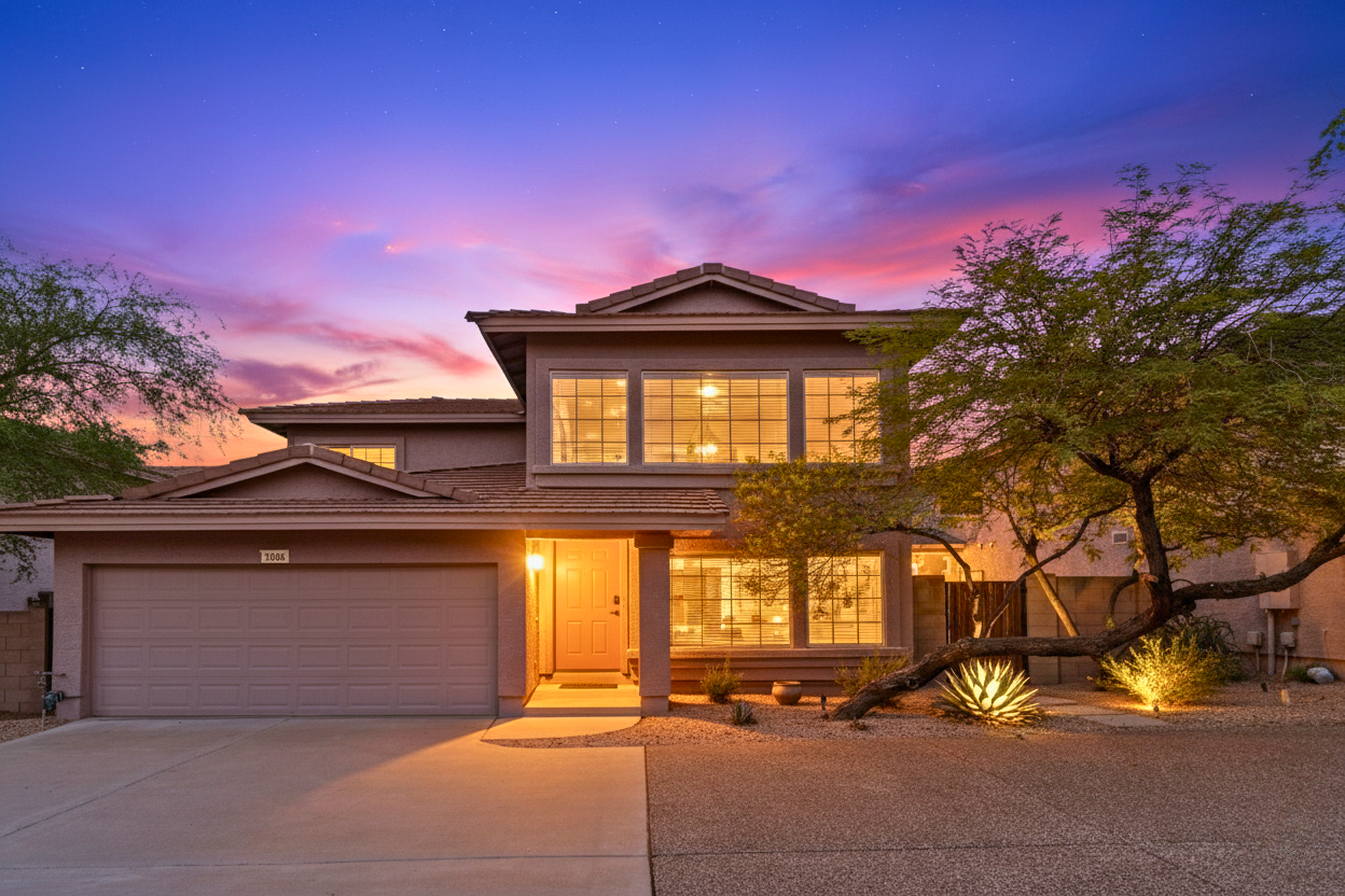 Sold North Scottsdale single-family home at 7650 E Williams Dr #1064 in a gated Scottsdale community, featuring twilight exterior photography, desert landscaping, and record-setting sale for a non-updated property in the Greater Phoenix Metro real estate market.