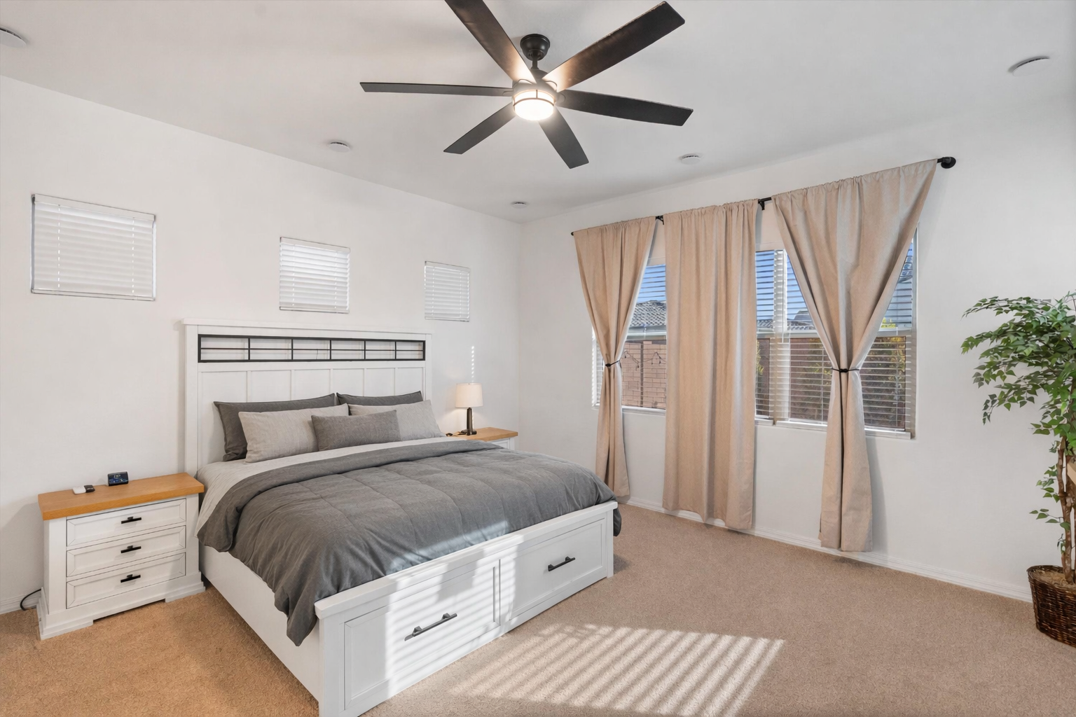 spacious primary bedroom in Alamar Avondale AZ home with flexible layout, split floor plan, large windows and private retreat feel separate from secondary bedrooms