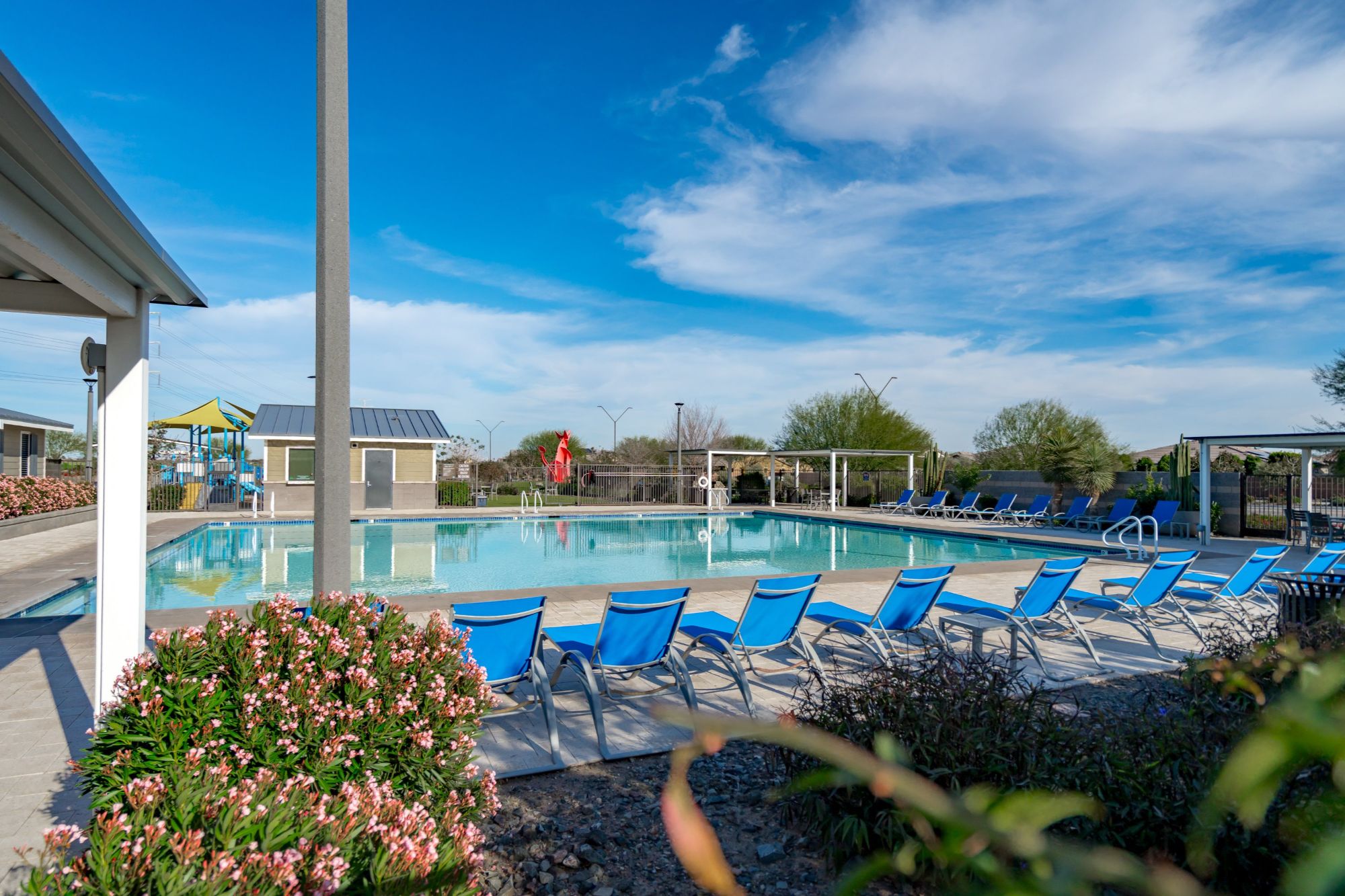 Alamar community pool in Avondale AZ with resort style amenities, lounge seating, walking paths and family friendly outdoor spaces in West Valley Phoenix