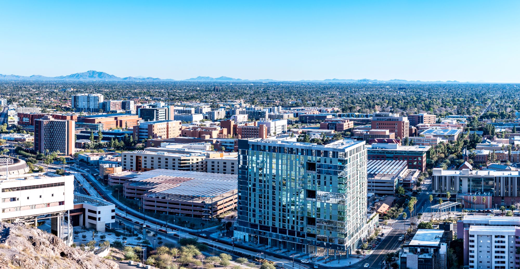Tempe Arizona real estate market featuring ASU campus, downtown Tempe skyline, and high-density housing, ideal for Airbnb, mid-term rentals, and investment properties driven by student and job demand