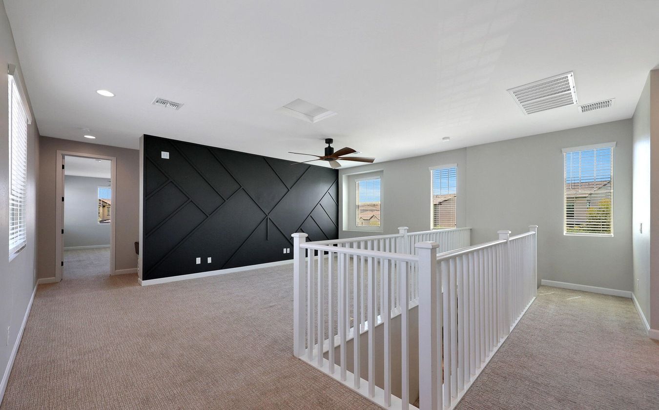 Spacious second-floor loft inside a newer construction home in Union Park at Norterra, North Phoenix, Arizona, highlighting modern layouts and low-maintenance design that attract renters and investors seeking properties near the TSMC semiconductor campus.
