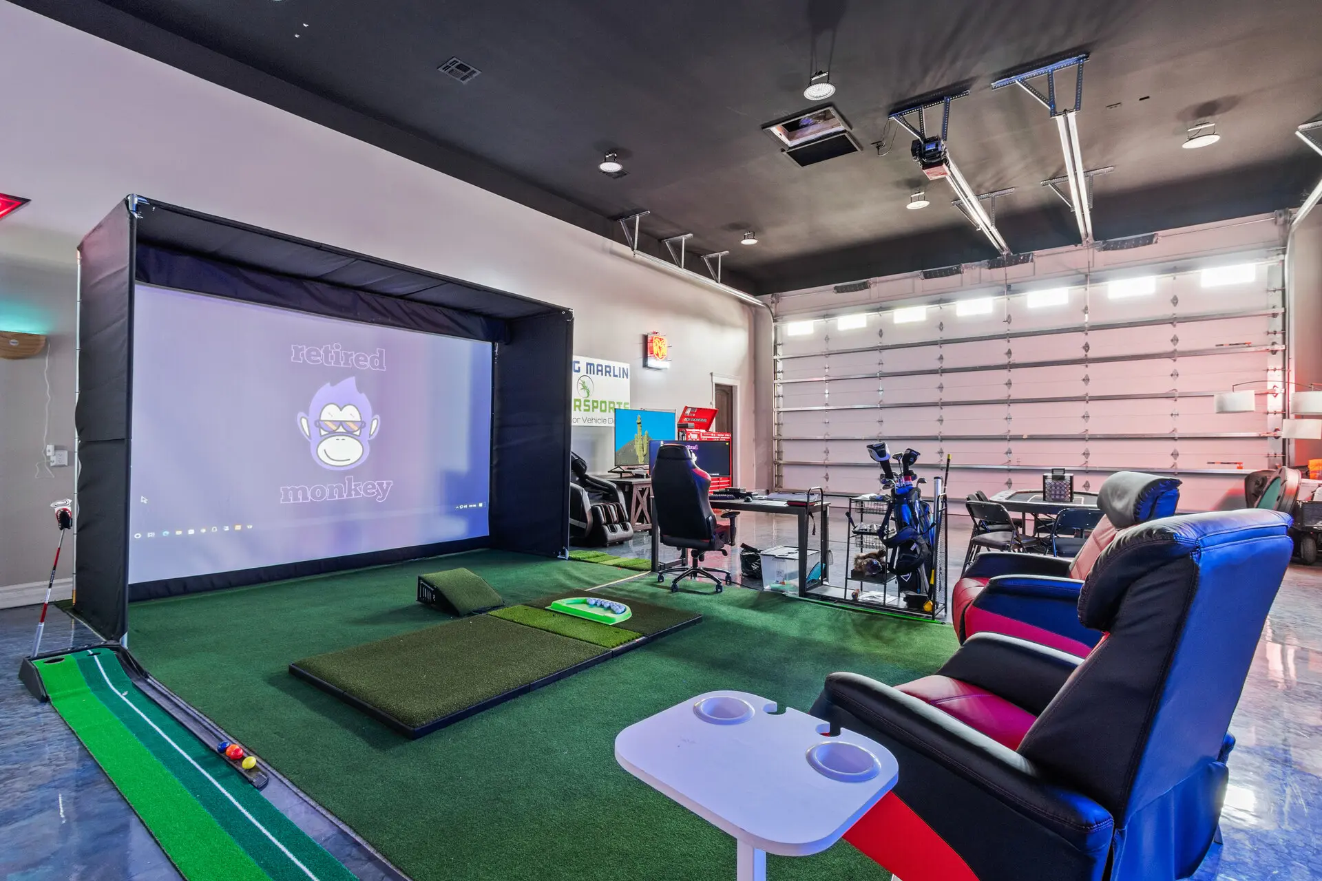 Arizona STR garage converted to golf simulator entertainment room — unique Airbnb amenity that commands premium nightly rates