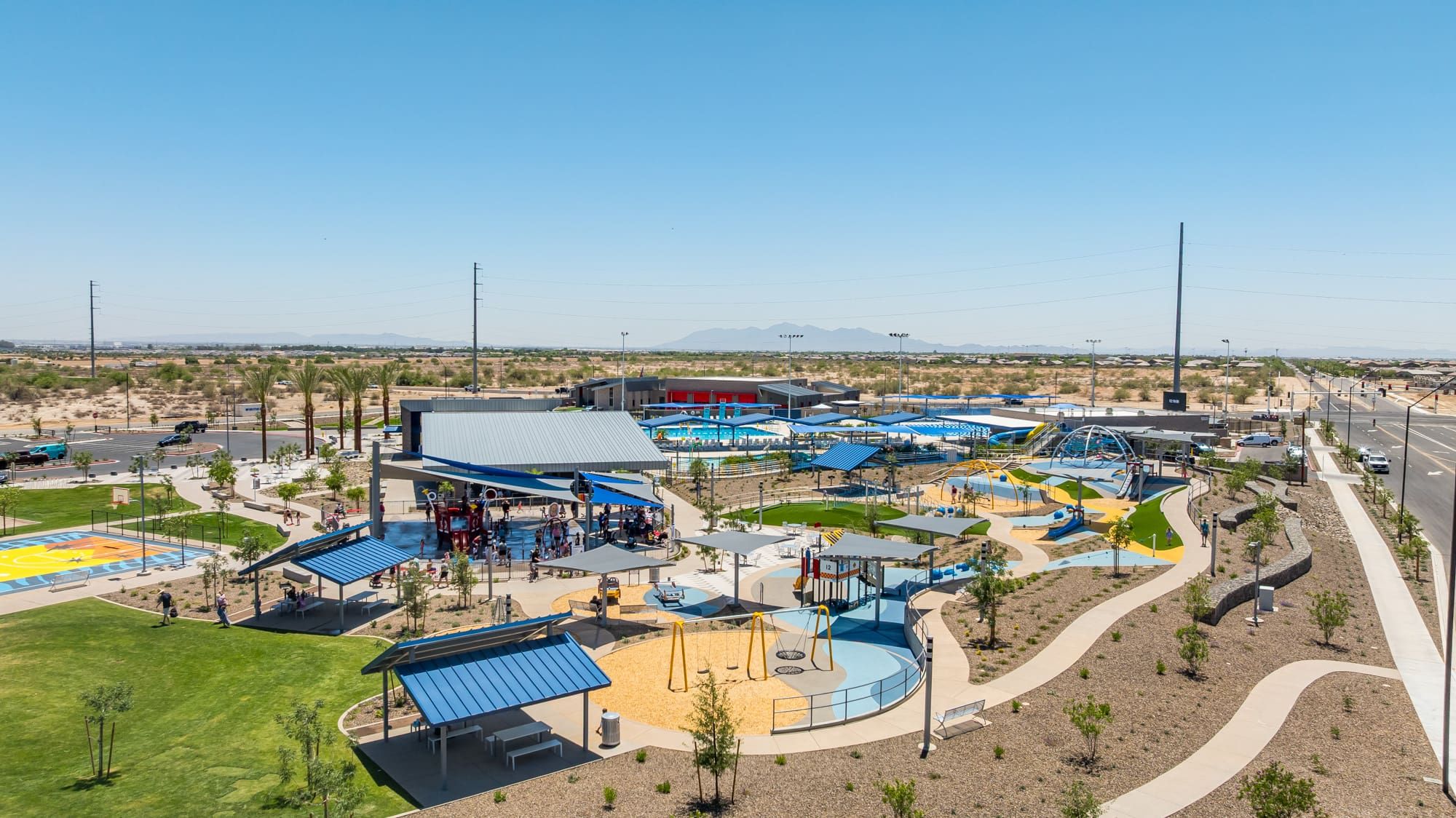 Outdoor park and water park in Surprise Arizona showing families enjoying community amenities on a sunny day