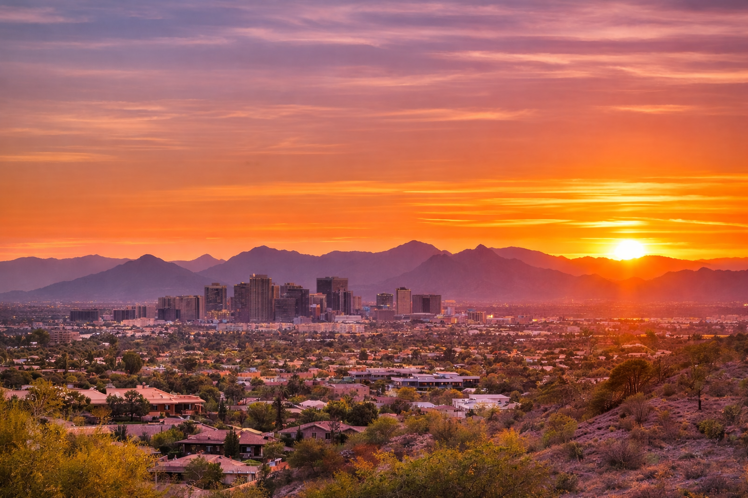 Aerial view of the Greater Phoenix Metro at sunset, showing the vast scale of the Valley of the Sun