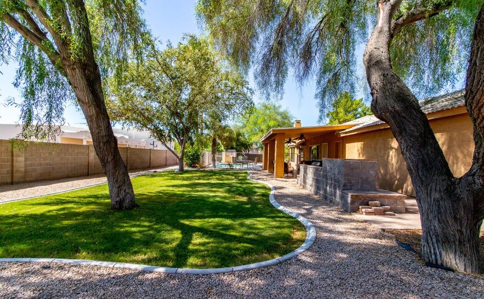 Putting green area before — empty lot Solterra Haus