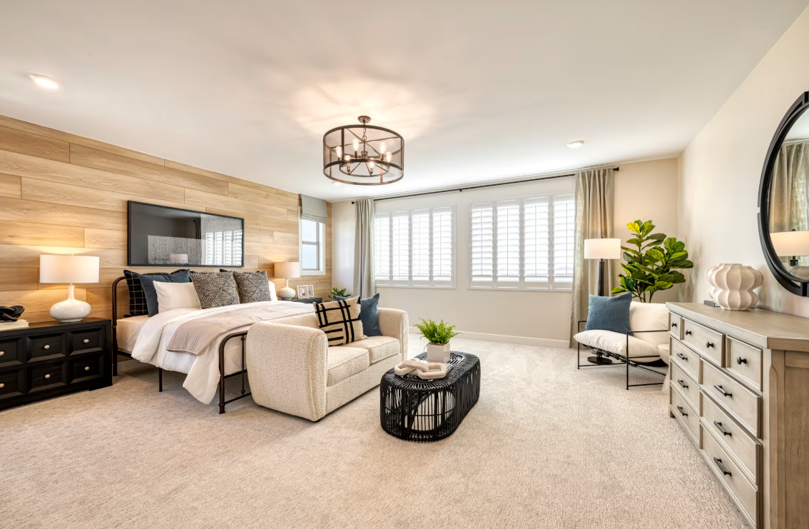 Primary suite bedroom in the Soleo home by TriPointe Homes