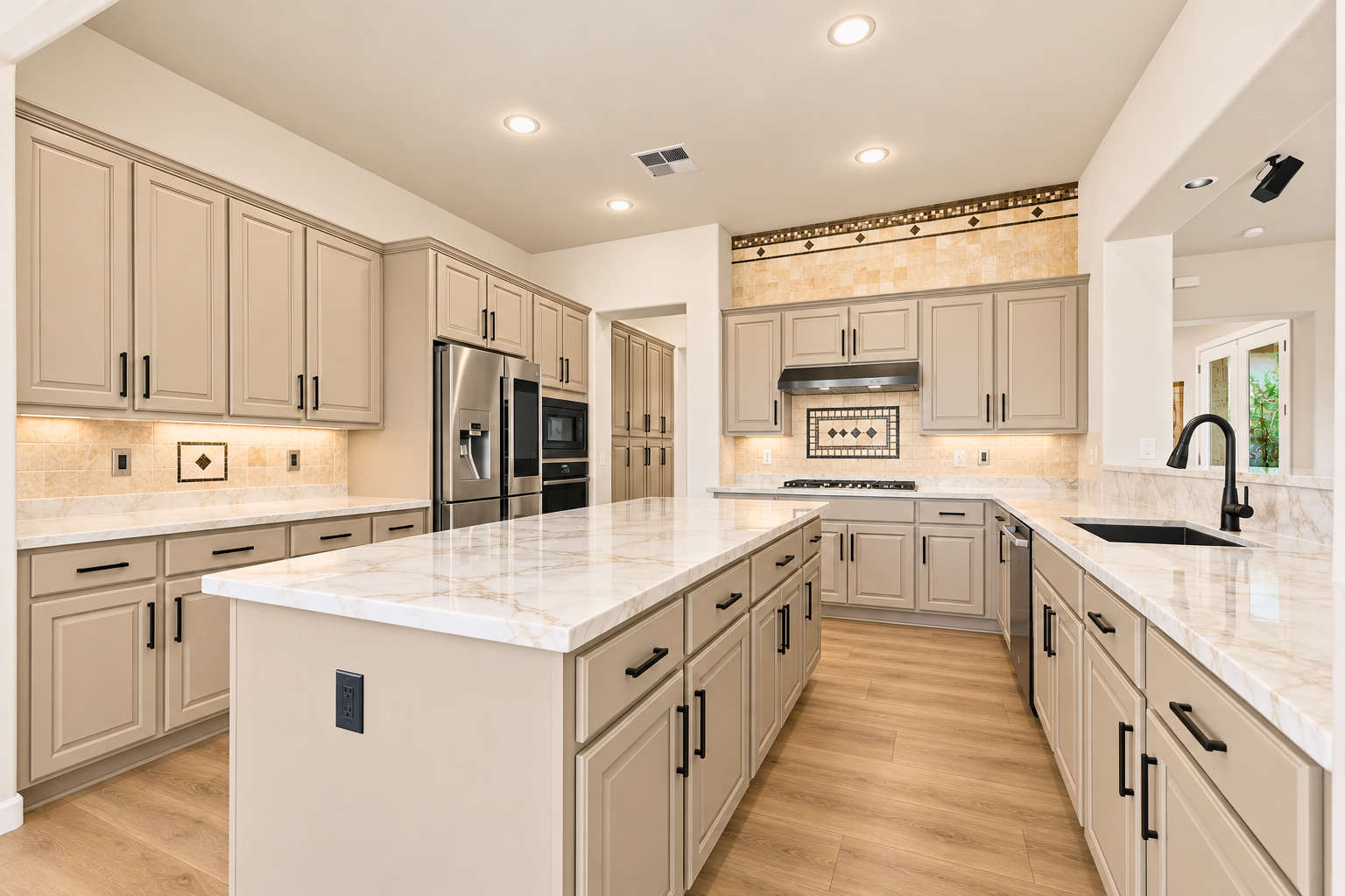 Kitchen after the refresh with new countertops and refinished cabinets