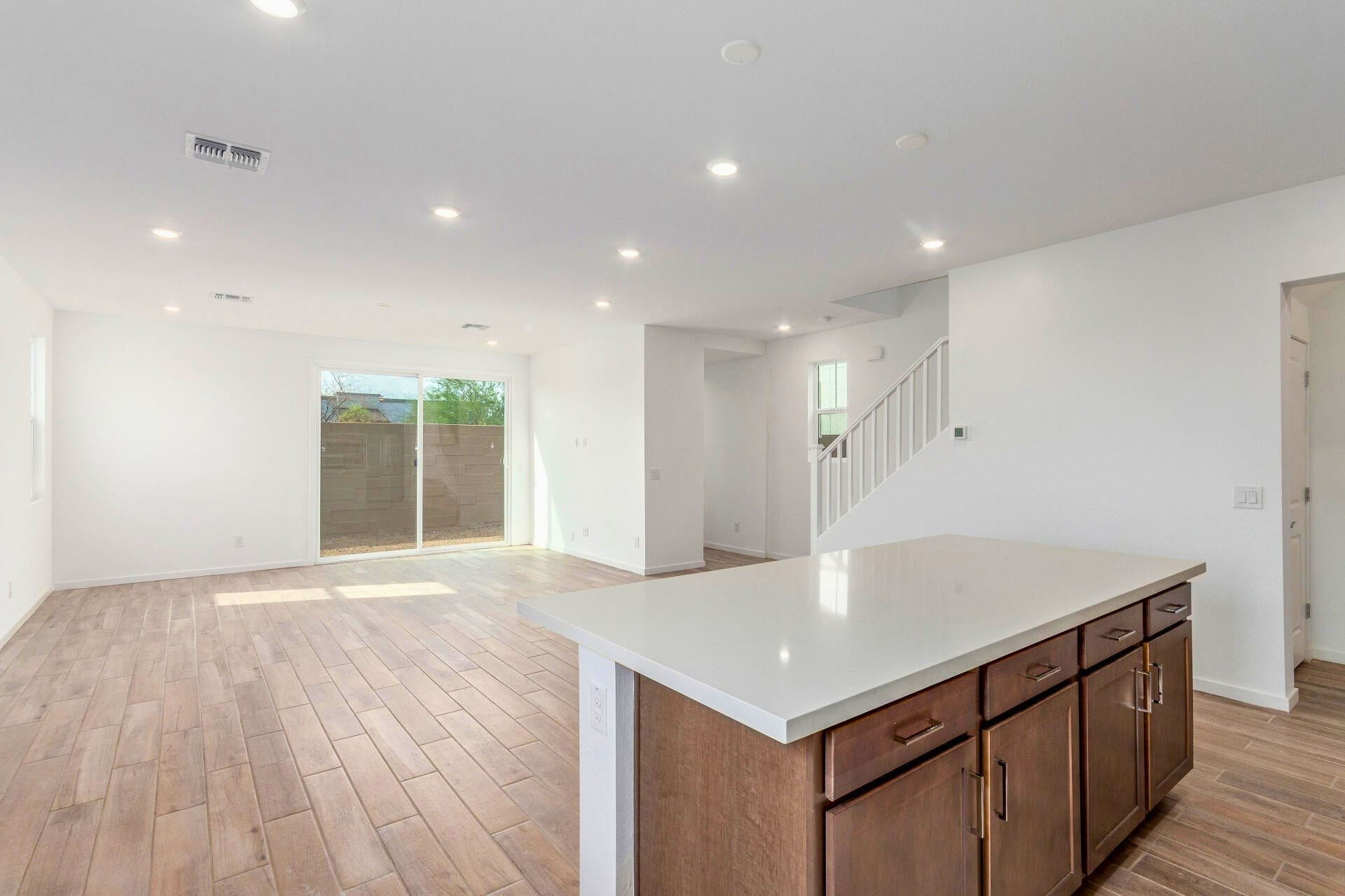 Open great room in North Phoenix new construction home at 2488 W Rowel Rd, Union Park at Norterra