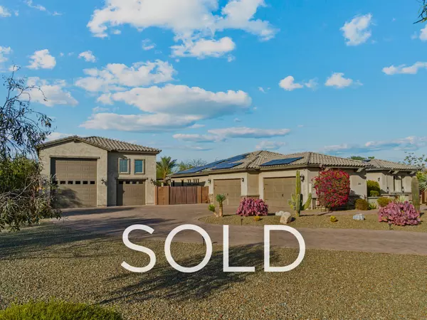 Luxury Arizona estate in Peoria with 30kW owned solar panels, RV garage, multi-car garage, and desert landscaping—sold by Eric Ravenscroft, Top 1% REALTOR® in the Greater Phoenix Metro.