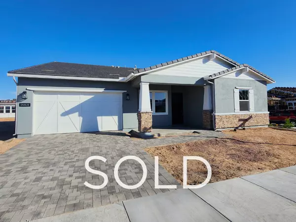 New construction Toll Brothers home in Sterling Grove, Surprise AZ with a modern exterior and paver driveway — sold by Eric Ravenscroft, Top 1% REALTOR® in the Greater Phoenix Metro.